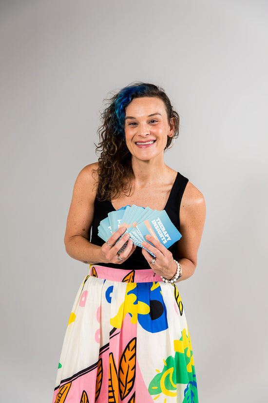 Juliet Kuehnle fanning out her mental health card decks